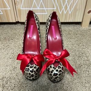 Bordello platform heels. Cheetah with red bow. Size 8. Never worn.